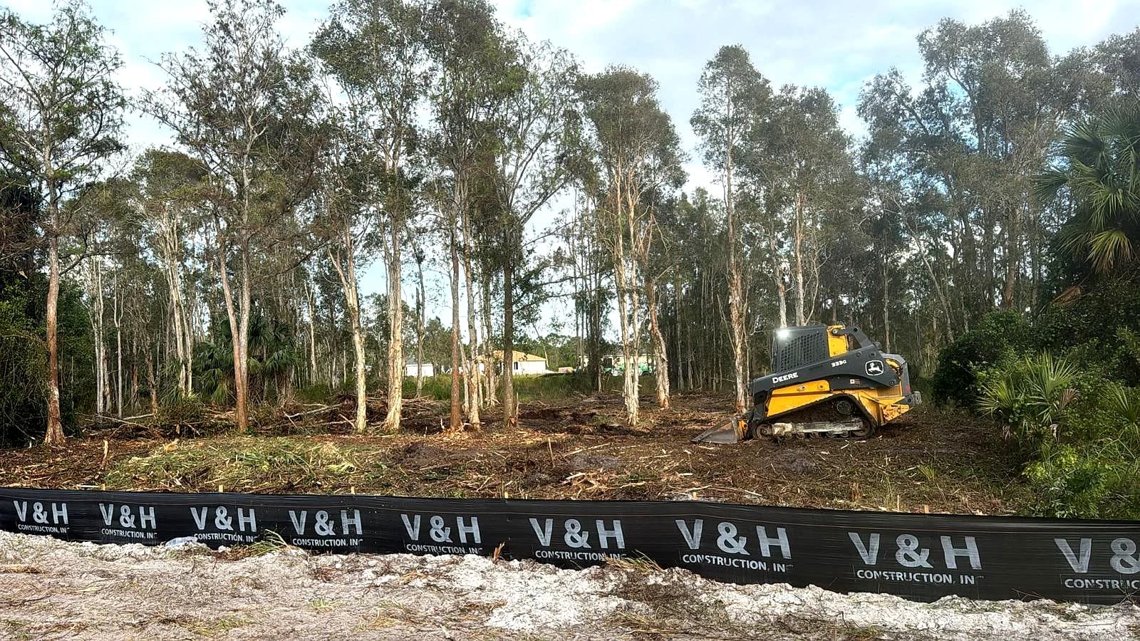 Vreeland Roofing's land clearing operation in progress, using heavy machinery to prepare sites for development in Florida.